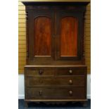 VICTORIAN OAK LINEN-PRESS the base having two long and two short drawers and with a two door linen