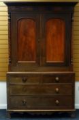 VICTORIAN OAK LINEN-PRESS the base having two long and two short drawers and with a two door linen