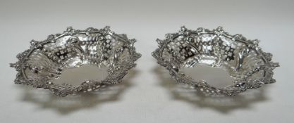 A PAIR OF DELICATE SILVER BON-BON BASKETS finely relief decorated with floral borders, 4.2ozs total