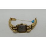 A BELIEVED GOLD-PLATED LADIES WRISTWATCH 'RIX, PARIS' with associated snake-style bracelet and
