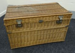 A GOOD LARGE VINTAGE WICKER LAUNDRY BASKET probably for commercial use with wicker handles and metal