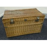 A GOOD LARGE VINTAGE WICKER LAUNDRY BASKET probably for commercial use with wicker handles and metal