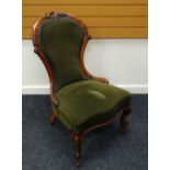 A QUEEN ANNE STYLE WALNUT SPOON CHAIR with carved rail and green upholstery