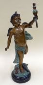 A BRONZE & PAINTED SPELTER EROS SCULPTURE on a circular base and with arm aloft, 66cms high