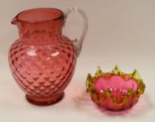 TWO ITEMS OF CRANBERRY GLASS being a large jug with clear glass handle and bowl with a vaseline