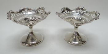 A PAIR OF MINIATURE SILVER BON-BON TAZZAS raised on circular bases with open-work decoration, 4ozs