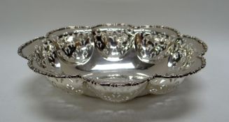 A SILVER BASKET of lobed form with pierce-work decoration, marks worn, 5.8ozs