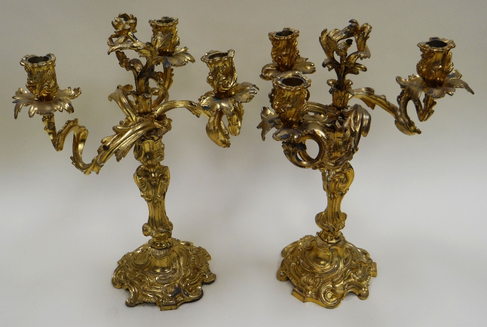 A PAIR OF FRENCH GILT BRONZE ROCOCO REVIVAL THREE-LIGHT CANDELABRA, of naturalistic form, late