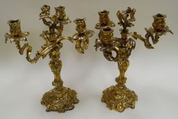 A PAIR OF FRENCH GILT BRONZE ROCOCO REVIVAL THREE-LIGHT CANDELABRA, of naturalistic form, late