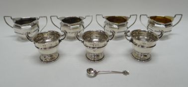 A SET OF FOUR MATCHING TWIN-HANDLED SILVER SALTS & A TRIO OF SIMILAR, 7.7ozs total
