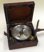 A JAMES WHITE OF GLASGOW SHIP'S COMPASS with silvered dial and brass case in a wooden and leather