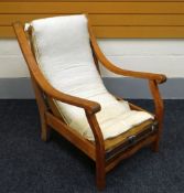 A 1932 OAK ARMCHAIR BY KEM WEBER (b. Germany 1889-1963) of streamlined form but lacking original