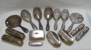 SILVER DRESSING TABLE ITEMS comprising two sets of four, a pair of oval brushes, a gent's machine-