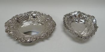 TWO DELICATE SILVER BON-BON DISHES being a heart-shaped and an oval example, both with prolific