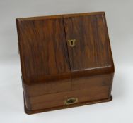 A MAHOGANY SLOPED STATIONERY CABINET with stepped interior and base drawers