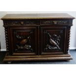A CONTINENTAL CARVED OAK DRESSER BASE composed of two cupboard doors and two drawers, the cupboard