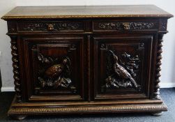 A CONTINENTAL CARVED OAK DRESSER BASE composed of two cupboard doors and two drawers, the cupboard