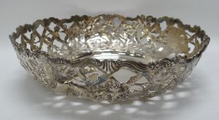 AN IRISH SILVER CENTREPIECE DISH of open lattice-work form and embossed with lions, birds and