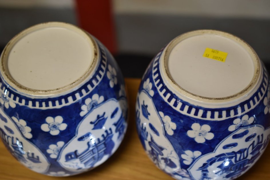 A PAIR OF CHINESE BLUE & WHITE JARS & COVERS each with four panels featuring items of domesticity - Image 3 of 11
