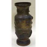 AN ORIENTAL BRONZE UMBRELLA STAND moulded in relief with carp and wetland wildlife, 46cms high (