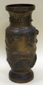 AN ORIENTAL BRONZE UMBRELLA STAND moulded in relief with carp and wetland wildlife, 46cms high (