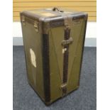 A VINTAGE CABIN TRUNK of compactum-form with drawers and original suit hanger, the exterior with