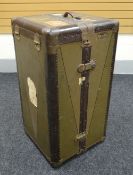 A VINTAGE CABIN TRUNK of compactum-form with drawers and original suit hanger, the exterior with