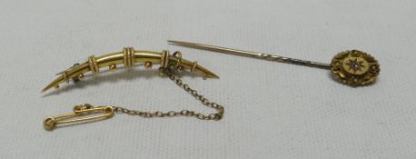 A YELLOW METAL (BELIEVED GOLD) CRESCENT BROOCH & A 15CT TIE-PIN