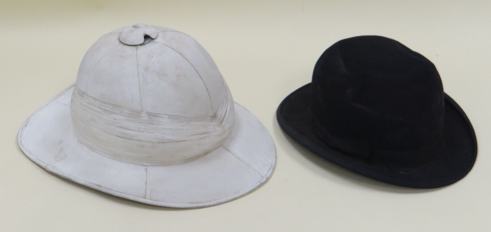 A CHRISTY'S LONDON BOWLER HAT & A COLONIAL PITH HELMET Provenance: The Estate of Thomas Ifor Rees,