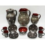 A WILLIAM FISHLEY HOLLAND STUDIO POTTERY REFRESHMENT SET in grey glazed slipware decorated with