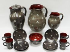 A WILLIAM FISHLEY HOLLAND STUDIO POTTERY REFRESHMENT SET in grey glazed slipware decorated with