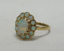 AN OPAL CLUSTER RING set in 9ct yellow gold, 3.53gms Provenance: receipt for purchase, £230 in