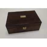 A ROSEWOOD WRITING BOX with brass mounts, and leather, compartmented interior, 35cms wide