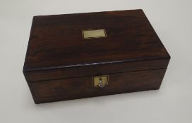 A ROSEWOOD WRITING BOX with brass mounts, and leather, compartmented interior, 35cms wide
