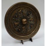 A CHINESE TANG STYLE BRONZE MIRROR of circular form decorated in relief with alternate rickshaws and