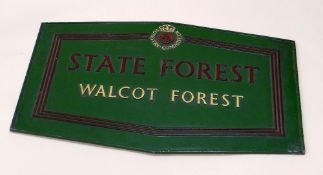 A PAINTED METAL FORESTRY COMMISSION SIGN 'STATE FOREST WALCOT FOREST' 76cms wide