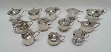 A COLLECTION OF TWELVE SILVER MUSTARD POTS all with hinged lids of various form and decorations,