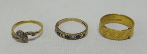 THREE RINGS including a 22ct wedding band, 6gms