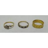 THREE RINGS including a 22ct wedding band, 6gms