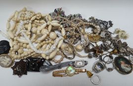 A TIN OF COSTUME JEWELLERY, IVORY / BONE BEADS, SILVER ITEMS etc