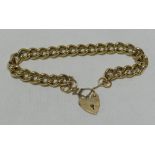 A 9CT CURB-LINK BRACELET & HEART-SHAPED PADLOCK, 44gms