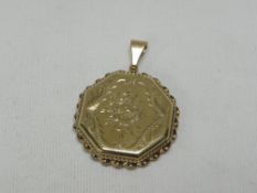 A 9CT YELLOW GOLD HEXAGONAL LOCKET, with floral engraving, 9gms gross