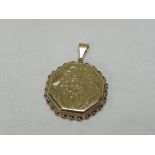 A 9CT YELLOW GOLD HEXAGONAL LOCKET, with floral engraving, 9gms gross