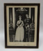 A FOREIGN OFFICE SIGNED PHOTOGRAPH OF ELIZABETH II & PHILIP in black and white and dated 1965,
