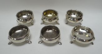 TWO TRIOS OF SILVER SALTS, both sets of cauldron form on pad feet, 10ozs