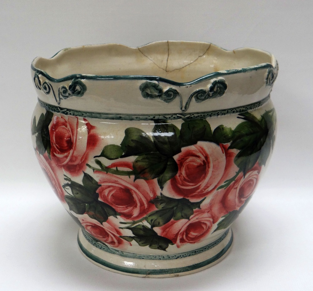 A LLANELLY PLANTER having a crimped rim, green lined and hand-painted with roses, 22cms diam (