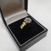 A FLORAL DIAMOND & 14K CLUSTER RING, 3.9gms