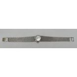 A BOXED TISSOT 9CT WHITE-GOLD LADIES WATCH having a circular silver dial, 26gms