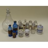 A QUANTITY OF ANTIQUE PHARMACEUTICAL GLASS & POTTERY VESSELS including a large pear-shaped glass