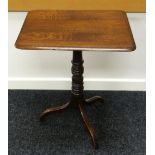 AN ELM TRIPOD TABLE with rounded rectangular top and turned column base, 56cms wide